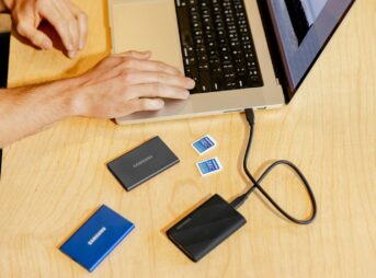 A person sitting at a table with a laptop